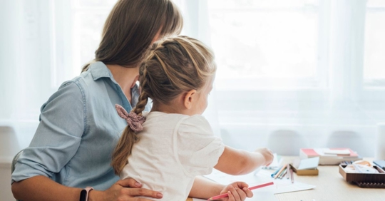 mom and daughter doing homework